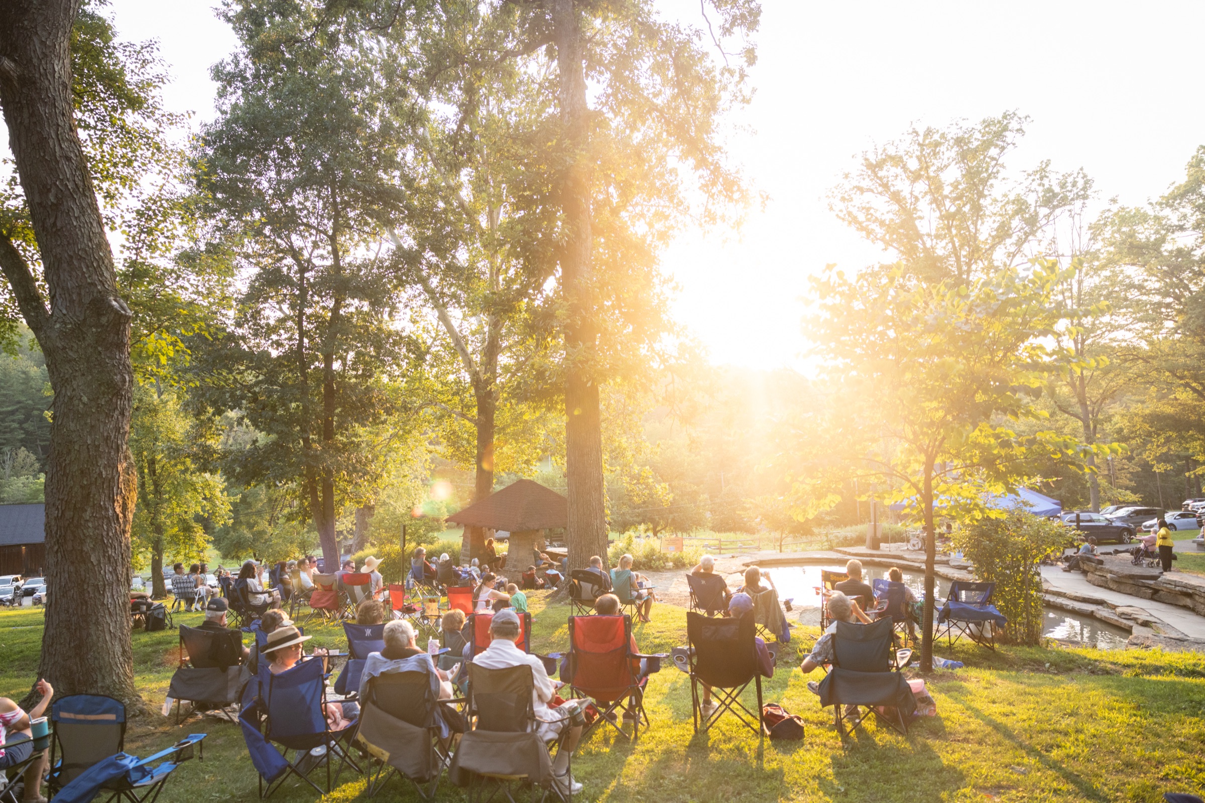 Jazzmania Live audience in golden-hour light at The Cascades, South Park