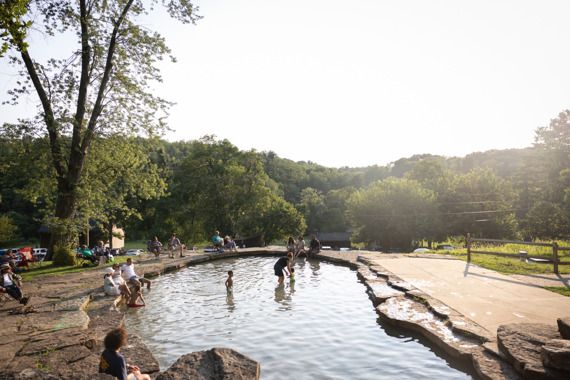 Children playing by the wading pool while live jazz plays at The Encore at The Cascades, South Park